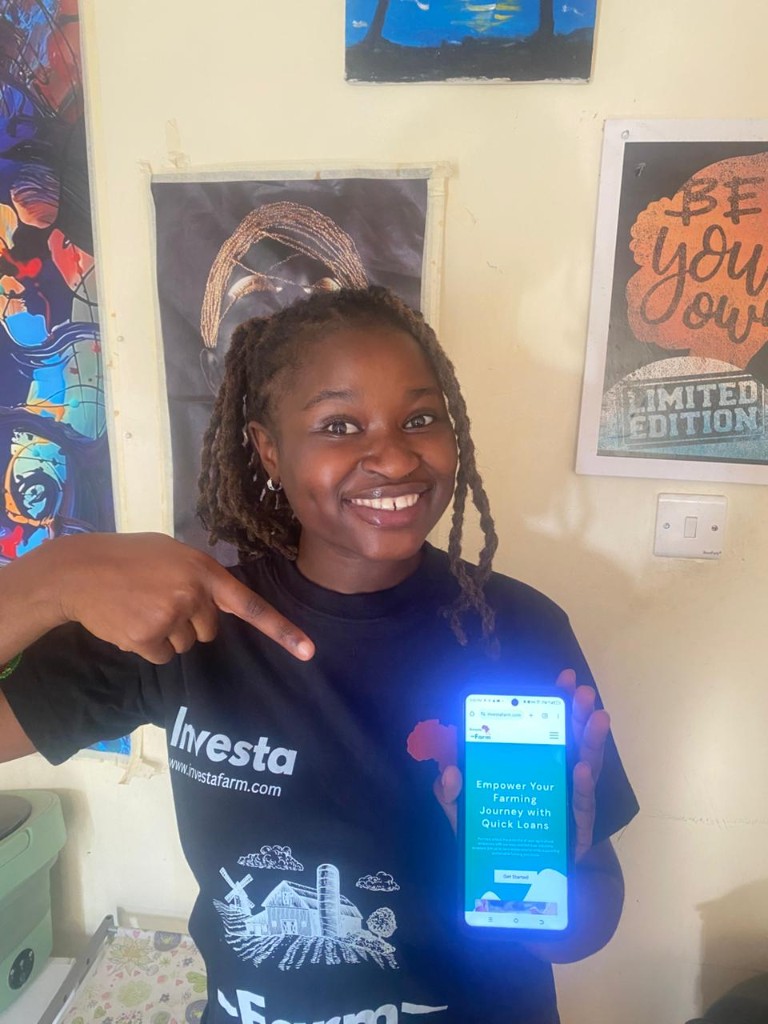 Investa Farm user showcasing mobile app